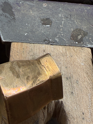 A close up of the vase showing scratches on the flared part